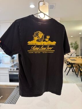 Aime Leon Dore Black Short Sleeve Tee with Yellow Globe Graphic
